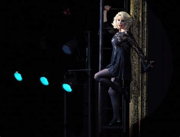 Christie Brinkley has legs for days sporting sheer tights and lace bodysuit in a throwback