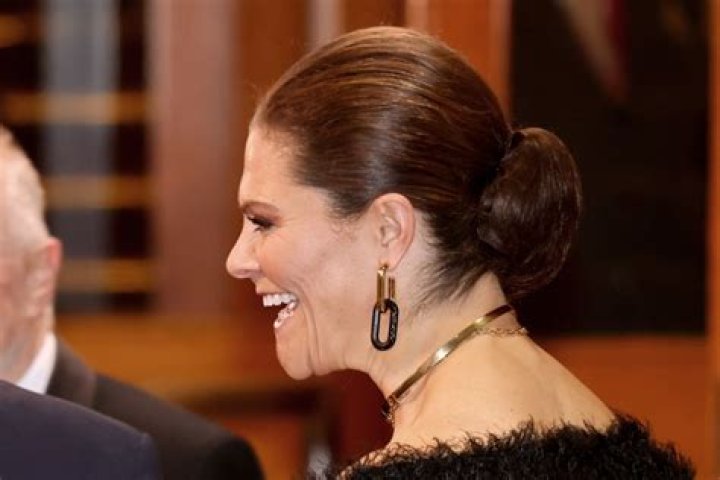 Crown Princess Victoria wows in slinky feathered gown for glitzy evening with Kate Middleton