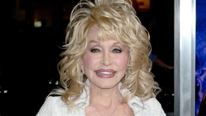 Dolly Parton is defiant in skintight pants and plunging corset following difficult confession