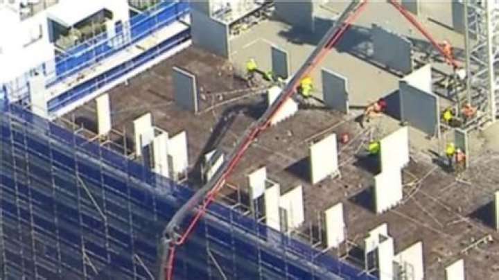 een taken to hospital after falling from Brisbane construction site