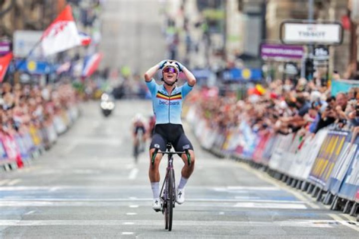 Former cycling world champ charged after Olympian wife's death