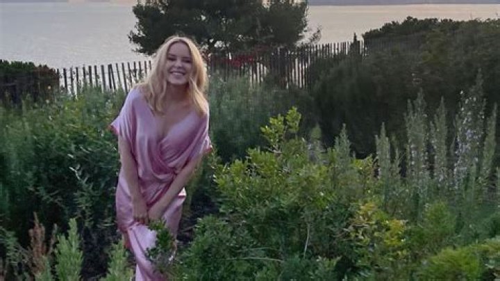 Kylie Minogue stuns in pink silk dress in rare holiday pictures from Greece